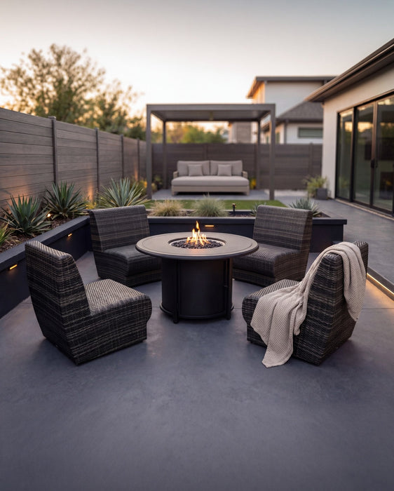 Woodard Genie curved lounge chairs around a fire table (pieces shown sold separately)