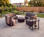 Woodard Genie 5-piece set: four curved armless lounge chairs in two facing pairs around a round ottoman (rug and bar cart sold separately)
