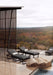 Woodard Harper chaise lounges on a pool deck overlooking the hills