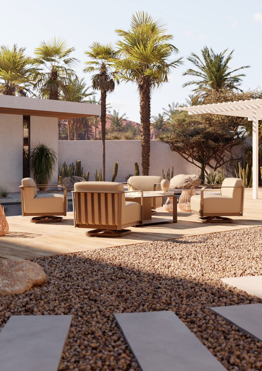 Woodard Juno lounge seating in a palm courtyard (some pieces shown sold separately)