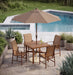 Woodard 9' Aluminum Market Umbrella with Auto Tilt in Hammered Pewter shown over a Woodard dining set