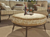 Woodard Cortland Spring Lounge Chair, with the Universal Oval Ottoman on a patio