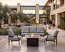 Woodard Nico sofa and two lounge chairs around a fire table (fire table sold separately)