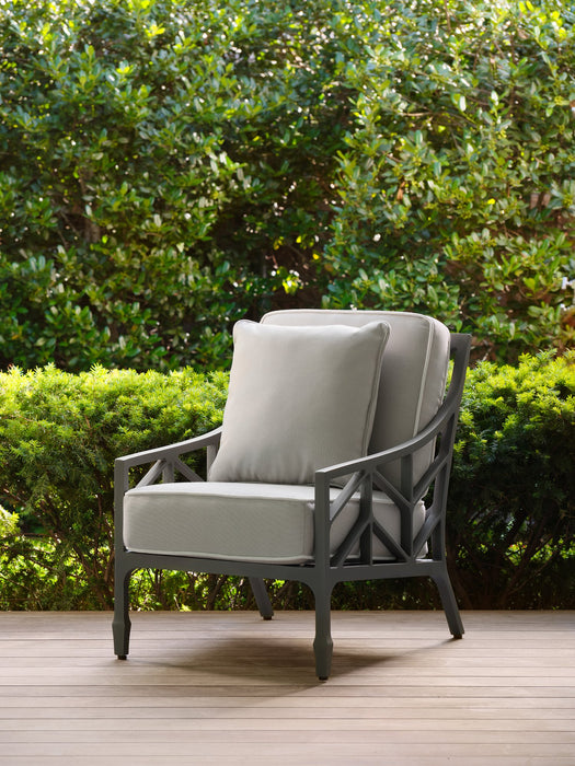 Woodard square throw pillow on a Woodard lounge chair