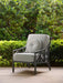 Woodard 16 inch round button pillow on a Woodard lounge chair