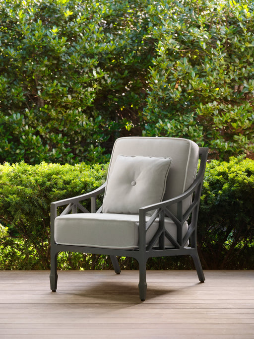 Woodard 16 inch square button pillow on a Woodard lounge chair