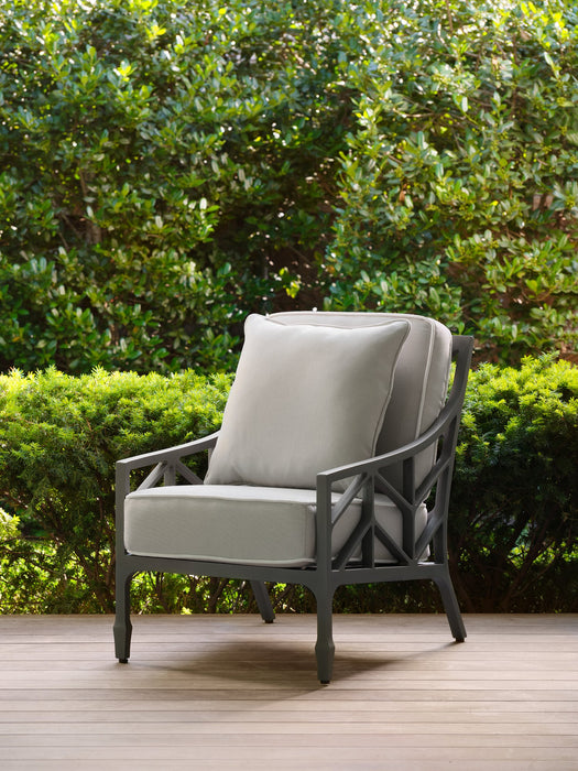 Woodard square throw pillow on a Woodard lounge chair