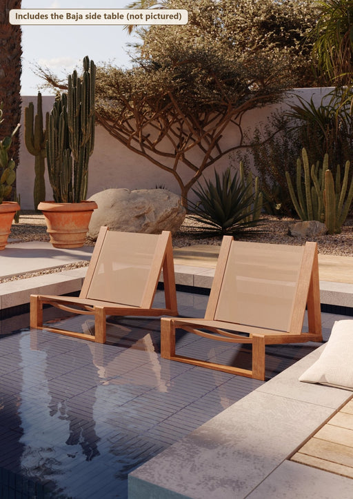 Two Woodard Sierra Baja sling lounge chairs by a pool (the Baja side table is included but not pictured)