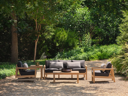 Woodard Sierra 4-piece lounge set: sofa, two lounge chairs and coffee table in Natural NexTeak with charcoal cushions