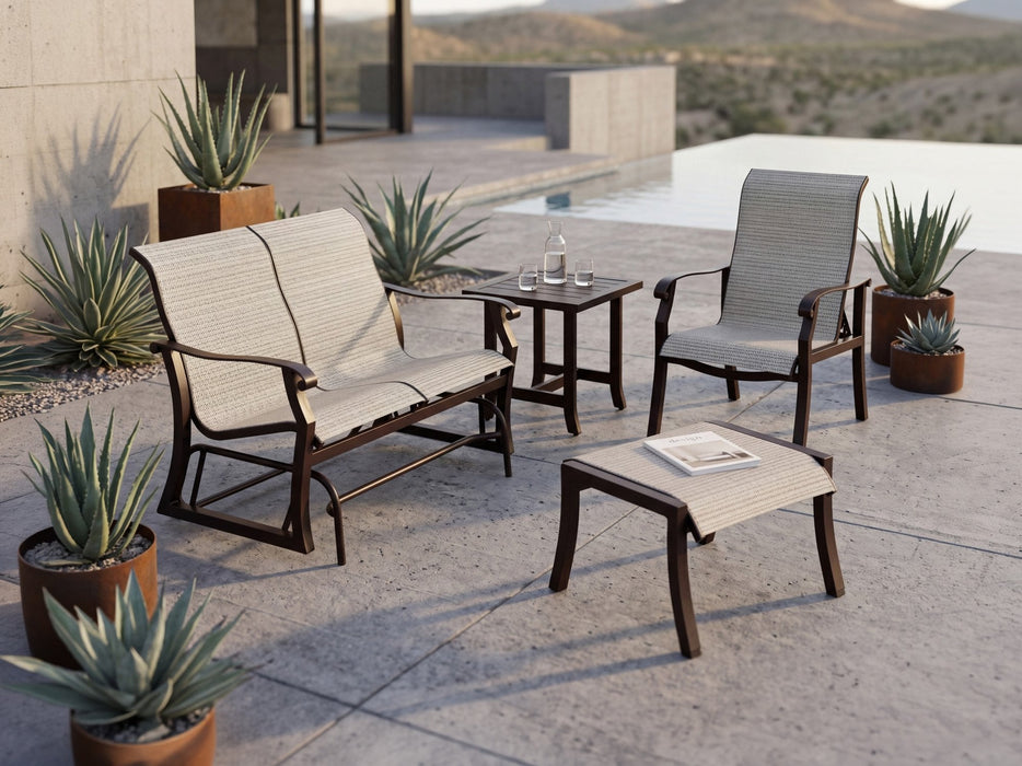 Woodard Cortland sling gliding love seat, lounge chair and ottoman with a Tri-Slat side table