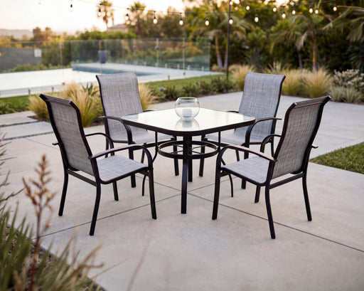 Woodard Deluxe obscure glass square dining table with four Fremont high-back sling chairs