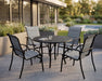 Woodard Thatch top round Tribeca base dining table with four sling dining chairs on a modern patio