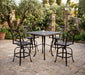 Woodard Wiltshire 5-piece bar set: four swivel bar stools at a Hampton square bar table in a stone courtyard