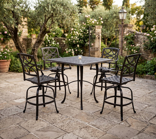 Woodard Wiltshire swivel bar stools around a Hampton bar table in a stone courtyard