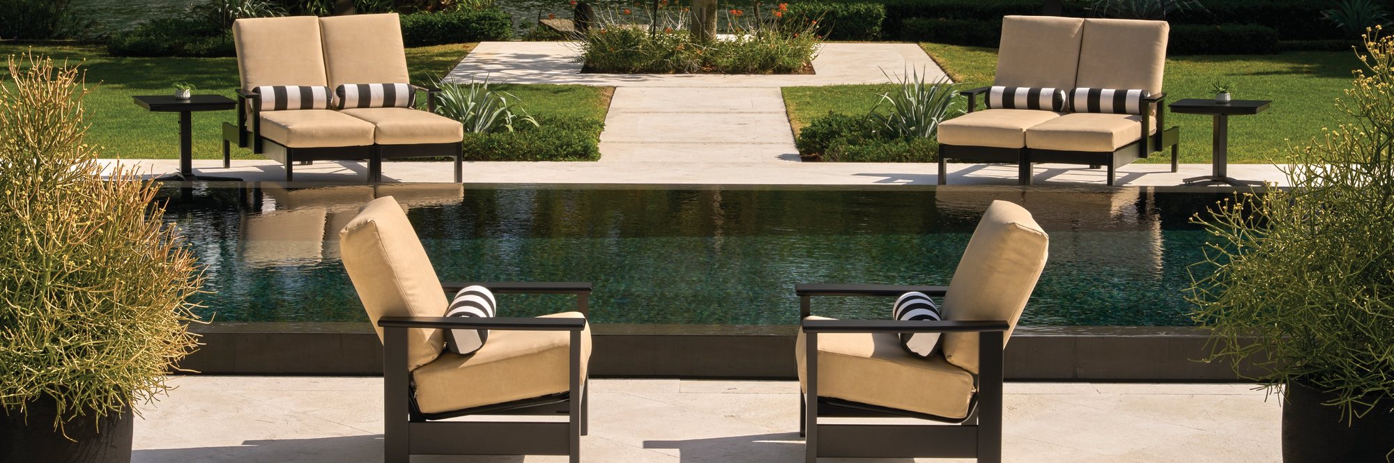 Leeward loveseats and lounge chairs by the pool